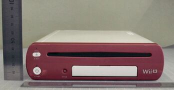 Front view of the Anatel Cafe Reader from the FCC Filings. The front is red in color similar to the RVT-H Reader.